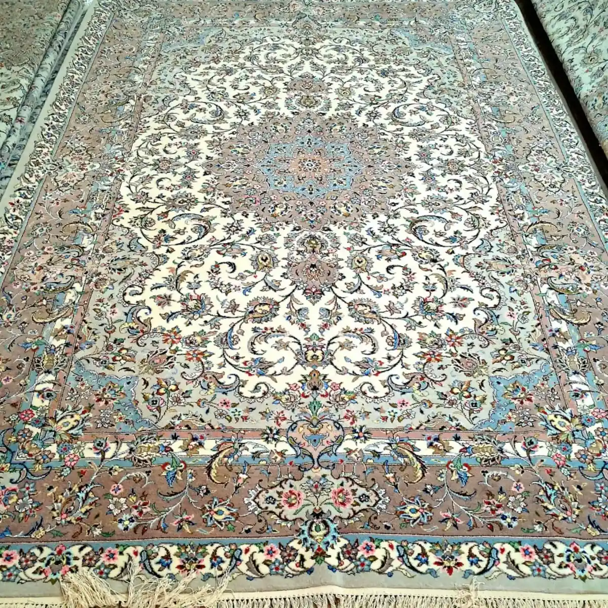 Full view of Sacred Lachak Toranj handmade Kashan carpet with ivory field, floral medallion and taupe-blue border
