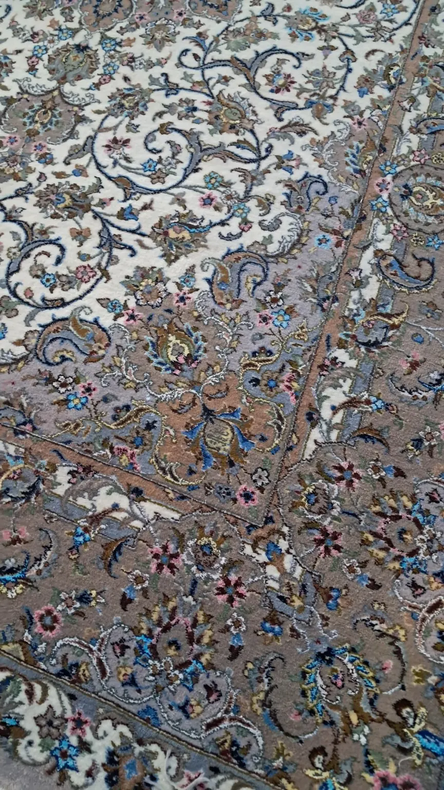 Close-up of PRR-KH-030 showing silk-highlighted Shah Abbasi flowers, scrolling vines and taupe border