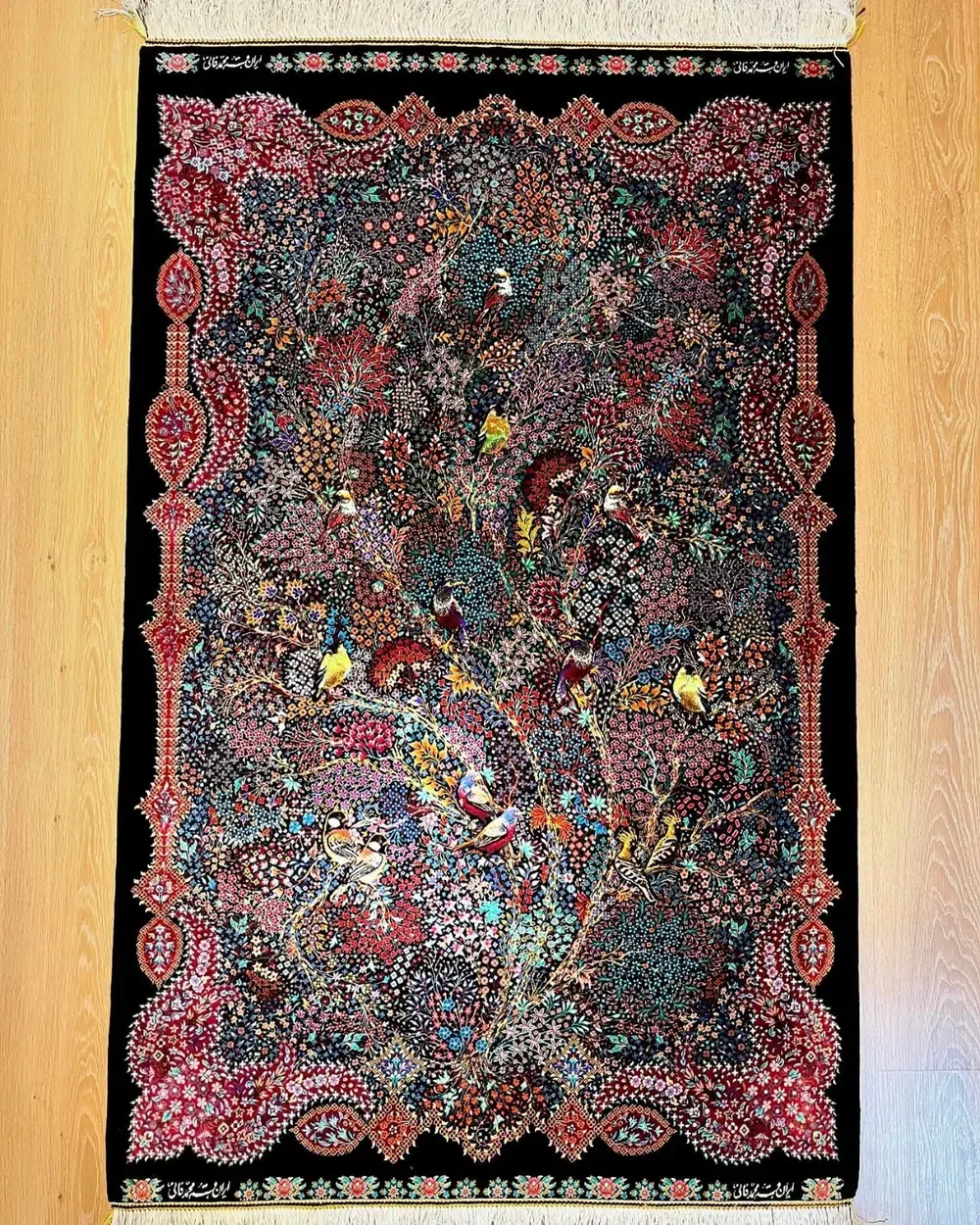 Royal Symphony of Songbirds handmade Qom pure silk carpet featuring the Persian Tree of Life with colourful songbirds