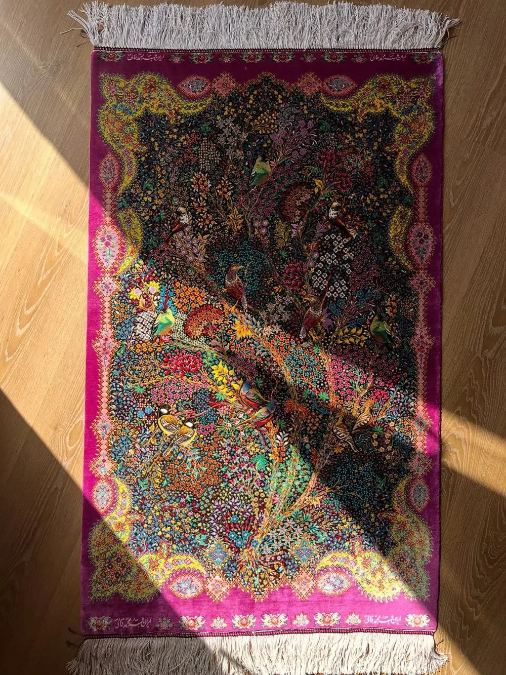 Crimson Aviary of Songbirds handmade Qom pure silk carpet with colourful birds, dense blossoms and a burgundy garden frame — detail 1