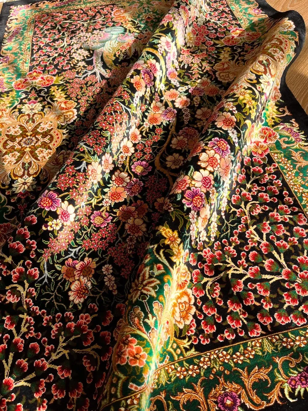 Crimson Orchard of Nightingales handmade Qom pure silk carpet with flowering trees, paired birds and an emerald floral border — detail 1