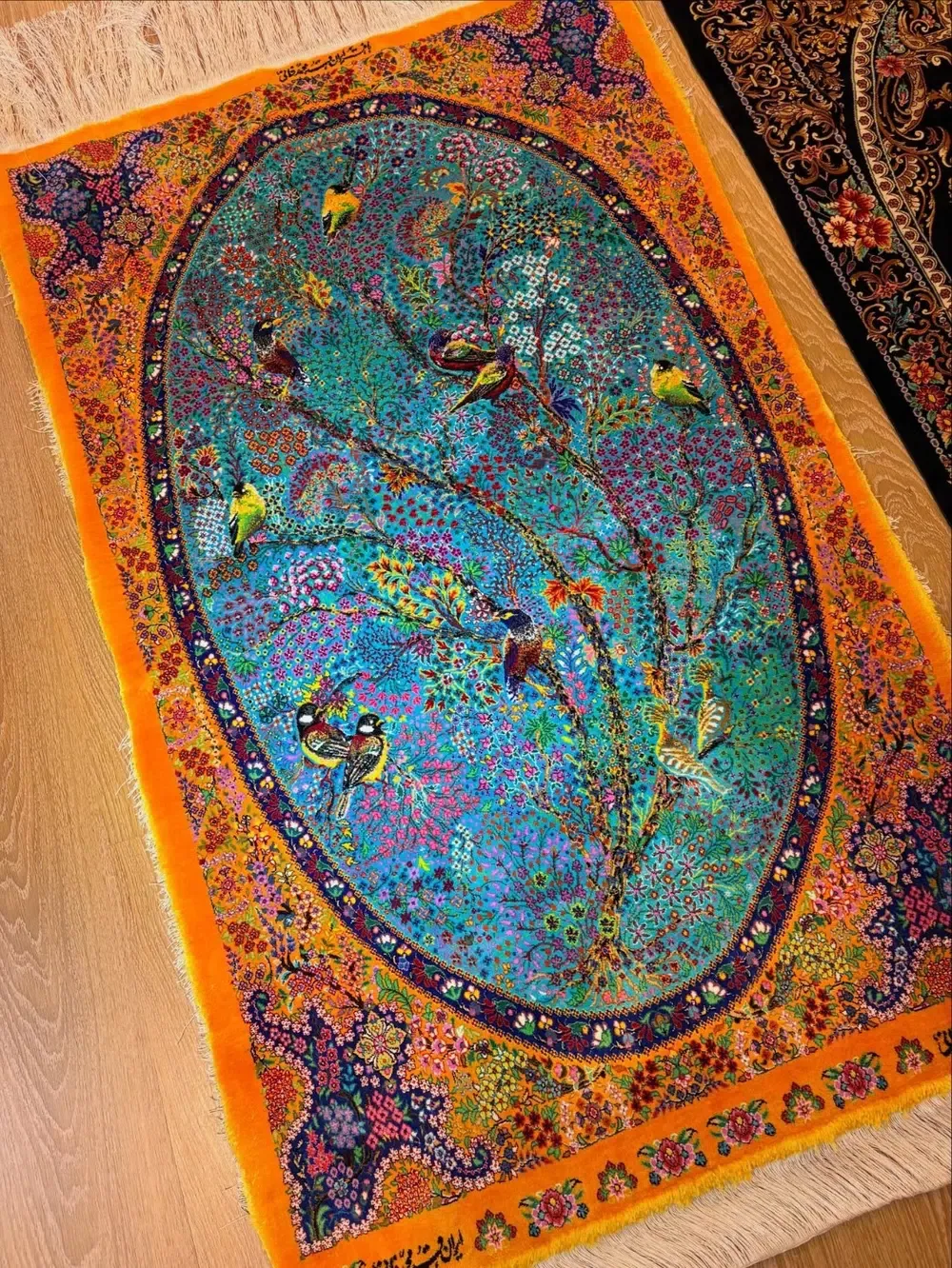 Turquoise Aviary of Dawn handmade Qom pure silk carpet with songbirds, flowering branches and an oval turquoise garden field