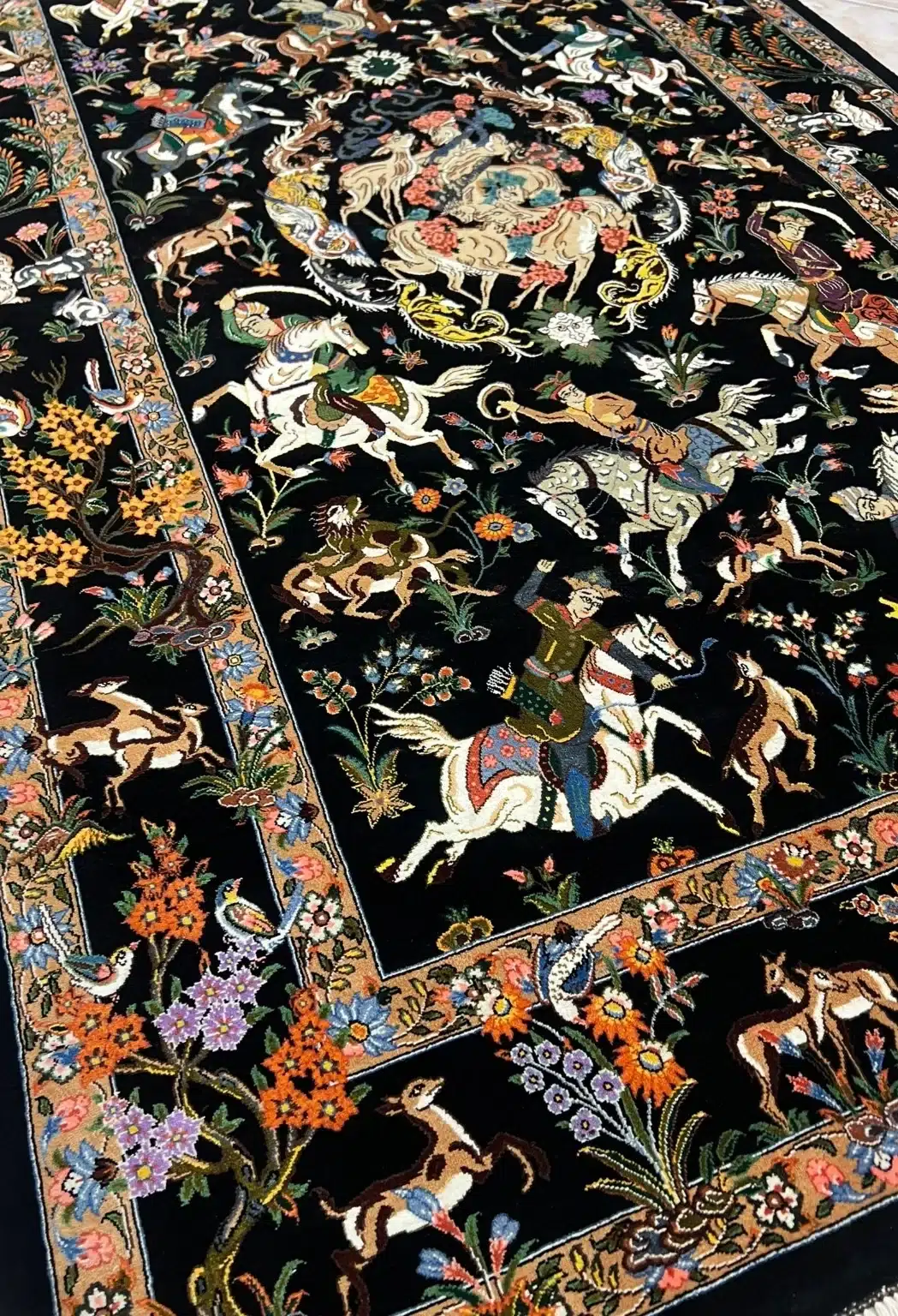 Midnight Imperial Hunt handmade Qom pure silk carpet featuring a vivid royal hunting narrative with mounted riders, wild animals and flowering garden borders