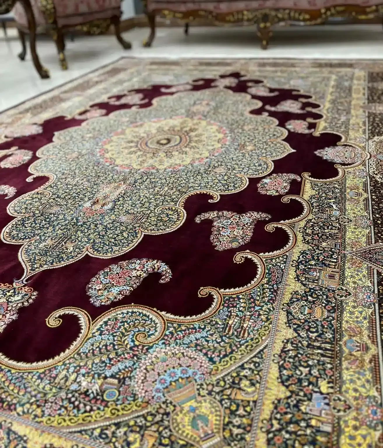 Burgundy Palace Grandeur handmade Qom pure silk carpet featuring a six-square-metre palace-scale medallion carpet with sweeping burgundy corners, garden motifs and architectural detailing