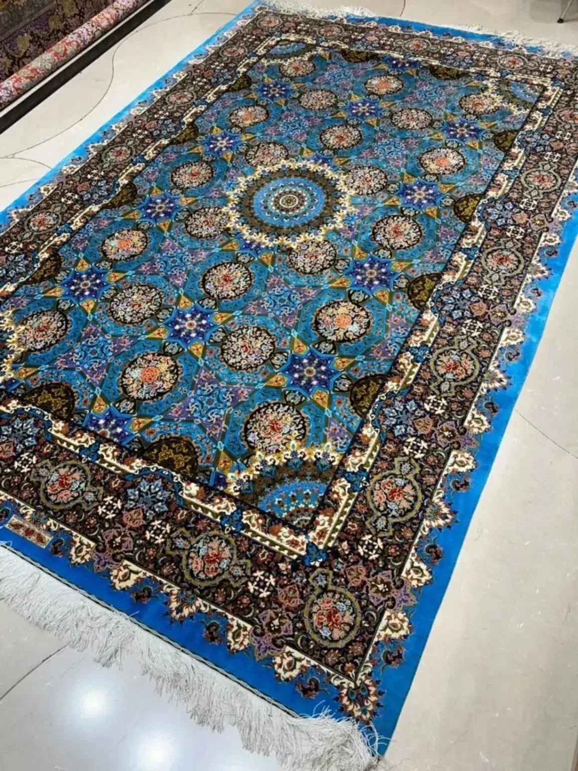 Azure Mosaic Rosette handmade Qom pure silk carpet featuring a geometric mosaic of floral roundels and star forms centred on an azure rosette